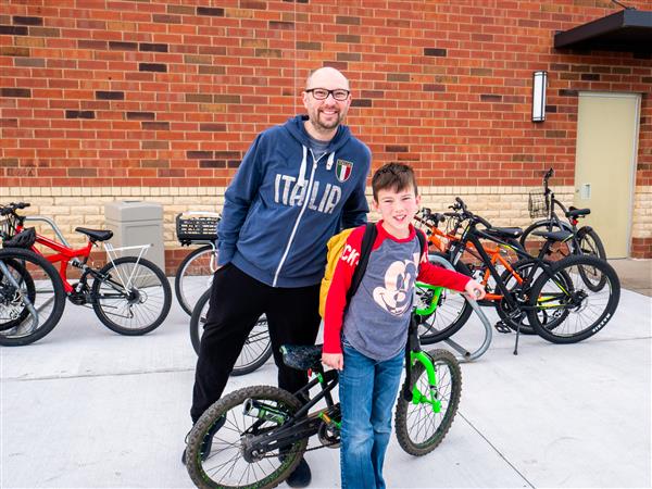 Students bike to school in the morning.